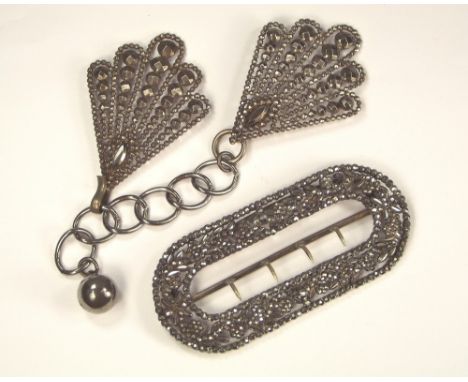 CUT STEEL. A large brass & cut steel buckle & a cut steel cloak clasp. Buckle 9 x 4cm.