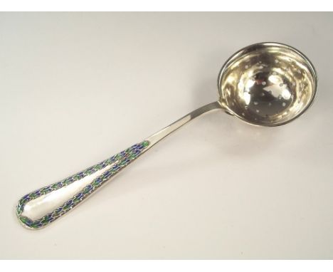 LIBERTY SPOON. A Liberty & Co. silver & enamel sifter spoon. Birmingham 1910.