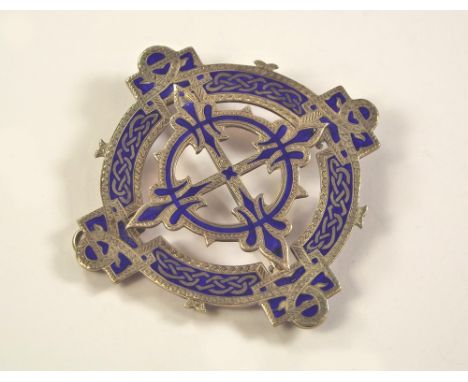 SCOTTISH PIN. A Victorian blue enamelled & silver plaid pin, with Celtic motifs. Stamped maker's mark G & MC. 6.5cm.