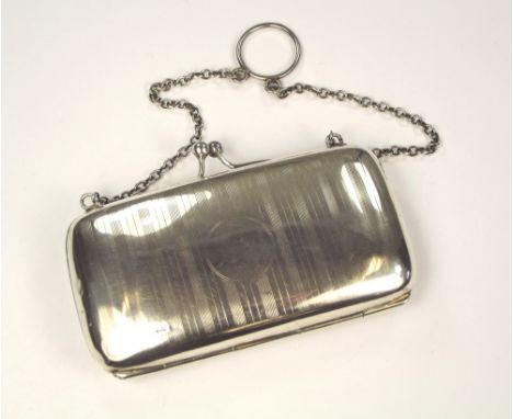 SILVER PURSE. An engine turned silver purse with chain & finger ring. 9.5 x 5.5cm.