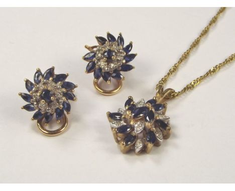 SAPPHIRE SUITE. A 9ct. gold mounted sapphire & diamond pendant on 9ct. gold chain & a pair of matching ear clips. Length of p