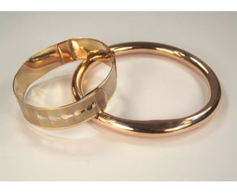 GOLD BANGLE ETC. A 9ct. gold hollow bangle, 20g. & a 9ct. gold plated identity bangle.
