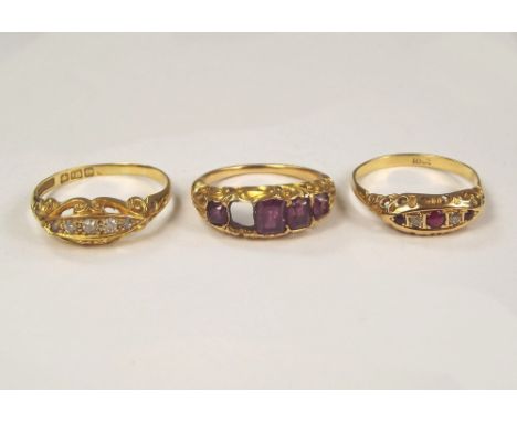 GOLD RINGS. An 18ct. gold, five stone diamond ring, an 18ct. gold ruby & diamond, five stone ring & an amethyst dress ring (o