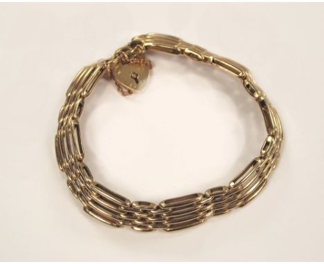GOLD BRACELET. A 9ct. gold gate bracelet with 9ct. gold padlock clasp. 17g.