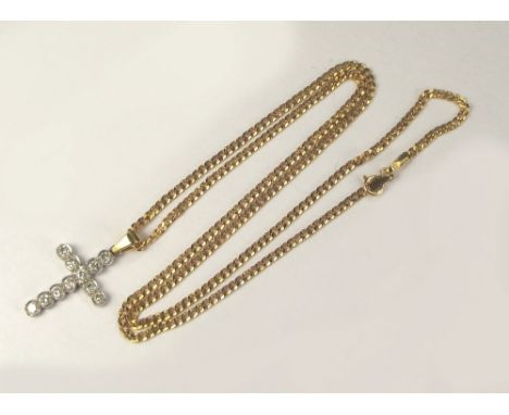 DIAMOND CROSS. An 18ct. white gold diamond cross with yellow gold bale on a 9ct. gold flat curb link chain. Full length of cr