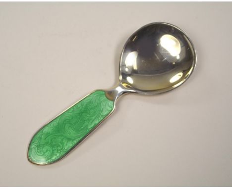 CADDY SPOON. A Norwegian silver gilt & enamelled caddy spoon. Length 11.5cm.