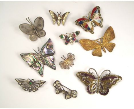 BUTTERFLY PINS. Ten butterfly pins in silver filigree, enamel, abalone, paste etc.