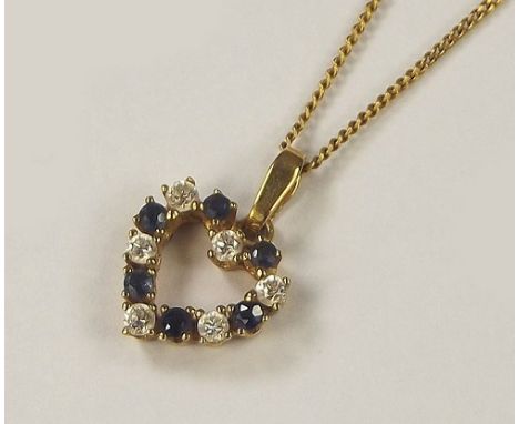GOLD PENDANT.A 9ct. pendant set with blue & white stones on a 9ct. gold chain.