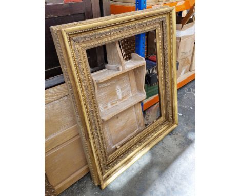 Gilt carved wood and moulded picture frame of rectangular form with bead, egg and dart and acanthus borders, 99cm x 86cmCondi