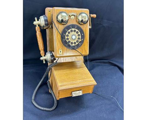Vintage classic wall hanging phone in working order in an oak case 