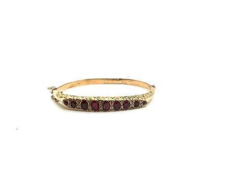 9ct gold garnet and ladies bangle 9.3 grams Birmingham 1907 hallmark 