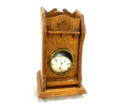 Vintage silver pocket watch in a wooden desk stand 