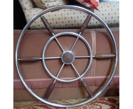 A VINTAGE STEEL AND HARDWOOD BOAT WHEEL