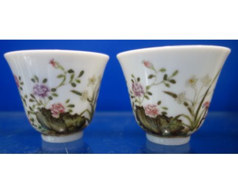 A PAIR OF 19TH CENTURY CHINESE KANGXI CUPS with six character mark to the bases, 5cm high