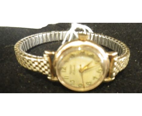 ROTARY: A LADY'S 17 JEWEL WRISTWATCH on an expanding yellow metal bracelet