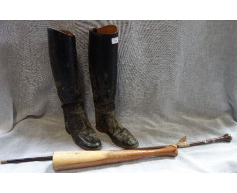 A PAIR OF BLACK HUNTING BOOTS, size 7, a walking stick and a tall wooden candlestick