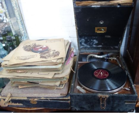 A VINTAGE HMV PICNIC GRAMOPHONE and a collection of 78s