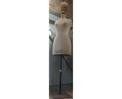 A VINTAGE DRESSMAKER'S DUMMY, on an iton stand by Yugin &amp; Sons Ltd