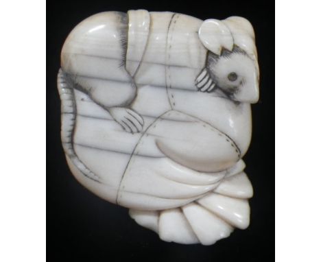 A JAPANESE CARVED IVORY NETSUKE, KYOTO SCHOOL, EDO PERIOD, EARLY 19TH CENTURY, modelled a s a rat burrowing into Hotei's trea