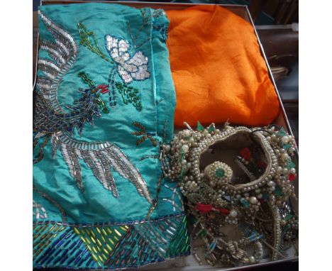 A VINTAGE CHINESE ORANGE SILK JACKET, a beaded green silk skirt and a beaded headress