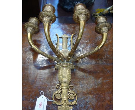 A 19TH CENTURY GILT BRASS FOUR BRANCH EMPIRE STYLE WALL LIGHT, 30cm high