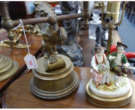 A BRASS TABLE LAMP IN THE FORM OF A LION and another similar with a Dresden group 