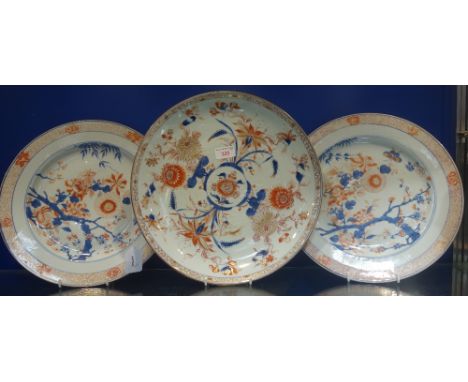 A LARGE PAIR OF CHINESE IMARI DECORATED DISHES, KANGXI PERIOD, painted with blossoming prunus branch, lotus and chrysanthemum