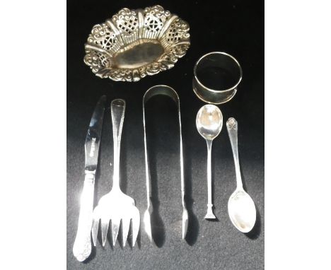 A PAIR OF GEORGE III SILVER SUGAR TONGS, a silver bon bon dish, napkin ring, two spoons, a silver handled fruit knife and a p