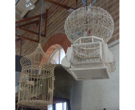 A VINTAGE INDIAN DESIGN WIREWORK AND WOODEN BIRD CAGE and another similar (2)