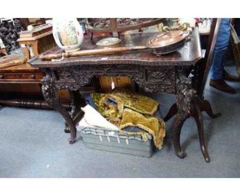A CHINESE EXPORT CARVED SOFTWOOD DESK, LATE QING DYNASTY, the rectangular scroll end top above an ornate frieze craved with d