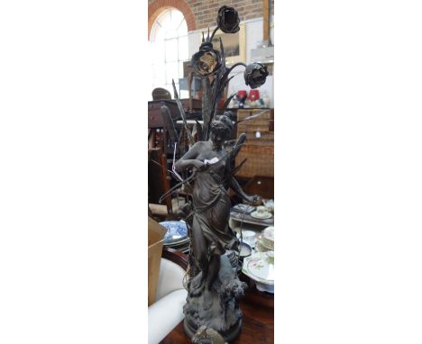 AN EARLY 20TH CENTURY SPELTER TABLE LAMP, in the form of a maiden with a dog and quiver, 103cm high