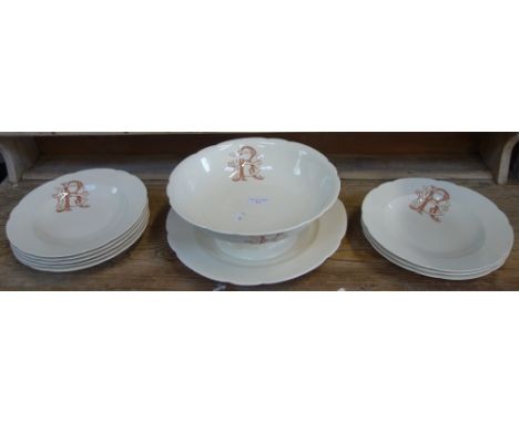 A FRENCH PART CREAM POTTERY DINNER SERVICE with transfer printed monogram 'R B', comprising footed bowl, charger and eight so