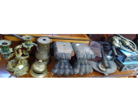 A 19TH CENTURY GILT BRASS CANDLESTICK, a pair of wooden carved furniture feet, curtain fittings and sundries