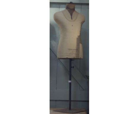 A VINTAGE DRESSMAKER'S DUMMY on an iron stand by Yugin &amp; Sons