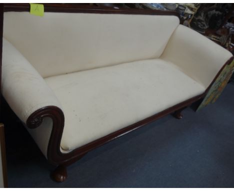 A REGENCY MAHOGANY FRAMED SOFA upholstered in cream upholstery, 201cm wide
