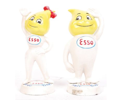 A pair of vintage style 20th century Esso advertising counter-top money banks of ' Herr &amp; Frau Tropf '. Both measures app