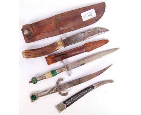 A collection of vintage 20th century knives to include a horn handled hunting knife, within leather sheath &amp; 2x decorativ