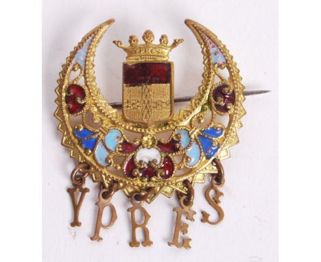 A beautiful WWI First World War era gold metal and enamel sweetheart's brooch. The central crest, surmounted by a crescent of