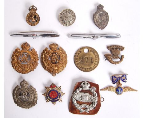 A collection of First &amp; Second World war cap &amp; pin badges comprising of; Royal Engineers cap badges, 'For Loyal Servi