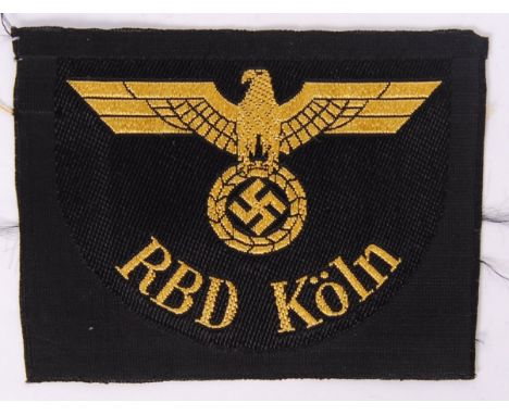 An original Nazi German Third Reich state railway RBD Kolm cloth patch, with Nazi swastika emblem to front. Measures approx 9