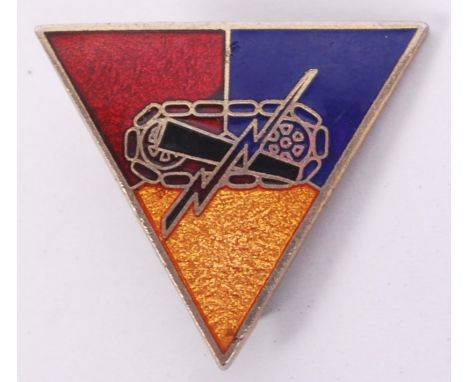 A 20th century French Special Forces triangular enamel pin badge with tank &amp; bolt of lightning emblem to front. Marked 'p