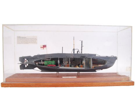 A museum quality scratch built finely detailed model by James Brain, B.E.M of the Royal Navy Midget Submarine HMS X7 with cut