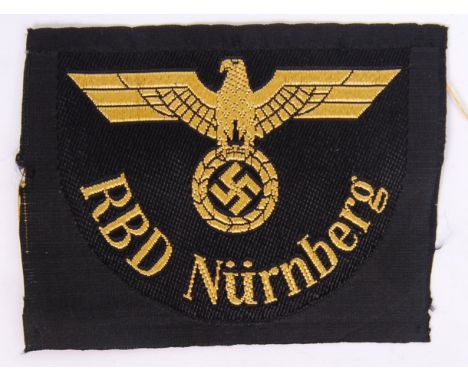 An original WWII Second World War Nazi German Third Reich railway RBD Nurnberg cloth patch, with eagle swastika emblem to fro
