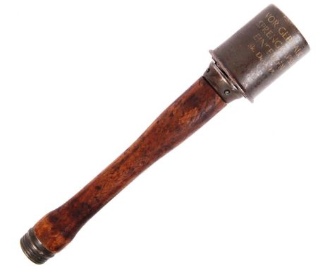 A WWII Second World War style German practice stick grenade (non-functioning). Various stamps and markings to the upper metal