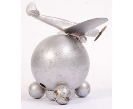 An unusual post-war 1960's alloy metal apprentice piece aeroplane, mounted to a globe. Base unscrews to reveal an electric me