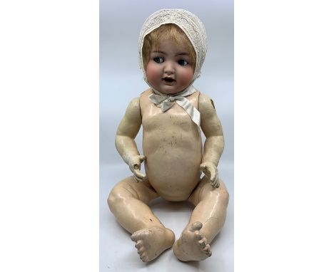 Kammer &amp; Reinhardt: An early 20th century bisque head doll, marked to head 'K*R Simon &amp; Halbig 126', hair glued down,