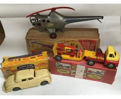 Tinplate: A collection of three boxed tinplate items to comprise: Wells-Brimtoy articulated lorry with bulldozer load. No tra