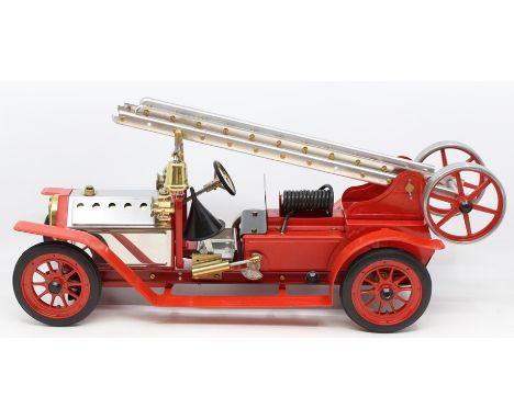 Mamod: An unboxed Mamod Fire Engine, FE1, red, appears to have seen little use, length approx. 18", missing two rungs from th