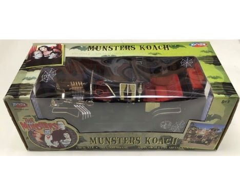 Monsters Koach 1:18 scale die cast vehicle by Joyride 2004. Boxed unopened.