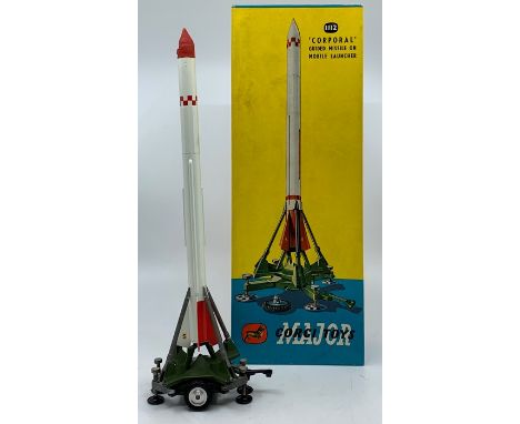 Corgi: A boxed Corgi Major Toys, 'Corporal' Guided Missile on Launcher, 1112, Rocket Age Models, white/red missile, green lau